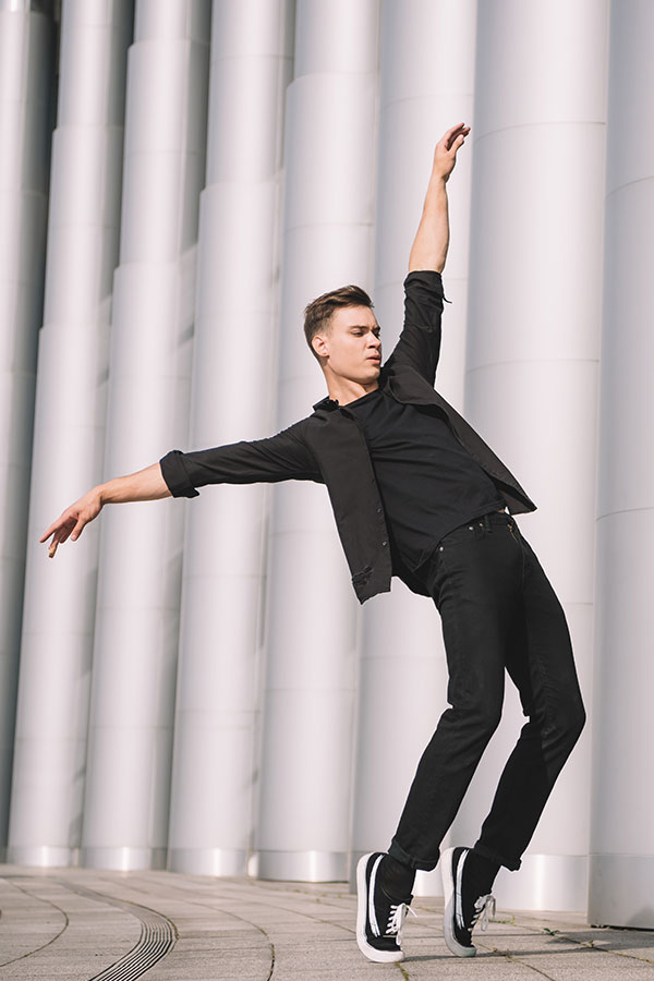 handsome-young-modern-dancer-dancing-near-columns-ESXPW2E.jpg
